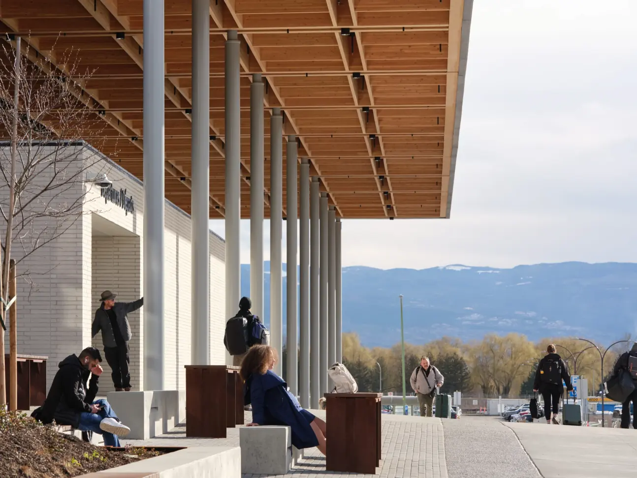 Kelowna International Airport terminal expansion, timber canopy and Okanagan mountains